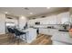 Bright, modern kitchen featuring white cabinets, a spacious island, and stainless steel appliances at 12712 W Corona Ave, Avondale, AZ 85323