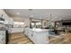 Open-concept kitchen with a large island and seamless flow into the dining and living areas at 12712 W Corona Ave, Avondale, AZ 85323