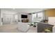 Cozy living room featuring large windows, plush seating, and modern decor at 12712 W Corona Ave, Avondale, AZ 85323