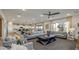 Spacious living room featuring contemporary furniture, a ceiling fan, and a neutral color scheme at 12712 W Corona Ave, Avondale, AZ 85323
