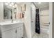Bright bathroom offering a white vanity, lighted mirror, and a shower-tub combination at 1402 E Guadalupe Rd # 114, Tempe, AZ 85283