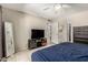 Cozy bedroom displaying tile flooring, a ceiling fan, and a television stand at 1402 E Guadalupe Rd # 114, Tempe, AZ 85283