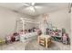 Adorable bedroom featuring a whimsical house-frame bed and a well-organized play area at 1402 E Guadalupe Rd # 114, Tempe, AZ 85283