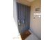 Secure front door with security gate and welcome mat reading 'Happy Home' at 1402 E Guadalupe Rd # 114, Tempe, AZ 85283