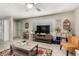 Inviting living room featuring a ceiling fan, a large window, stylish decor, and comfortable seating arrangements at 1402 E Guadalupe Rd # 114, Tempe, AZ 85283