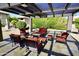 Cozy covered patio with a tiled floor and an arrangement of comfortable outdoor furniture at 1402 E Guadalupe Rd # 114, Tempe, AZ 85283