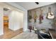 Open office space with wood accent wall, guitars, modern desk and natural light at 14393 W Wethersfield Rd, Surprise, AZ 85379