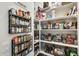 Organized pantry featuring shelving stocked with various food and household items at 14393 W Wethersfield Rd, Surprise, AZ 85379