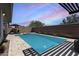 Backyard pool and spa offers a relaxing oasis in a private outdoor setting with beautiful sunset views at 14393 W Wethersfield Rd, Surprise, AZ 85379