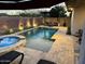 Inviting pool and spa area with travertine decking, a shaded pergola, and comfortable outdoor seating at 14393 W Wethersfield Rd, Surprise, AZ 85379