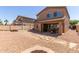 Large backyard featuring a covered patio with a grill and plenty of space for outdoor living at 14436 N 162Nd Ln, Surprise, AZ 85379
