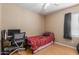 Bedroom with a desk, ceiling fan, and bright natural light at 14436 N 162Nd Ln, Surprise, AZ 85379