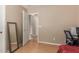 Cozy bedroom featuring neutral walls, wood-look flooring, and a full-length mirror at 14436 N 162Nd Ln, Surprise, AZ 85379