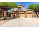 Charming two-story home featuring a tile roof and a spacious two-car garage at 14436 N 162Nd Ln, Surprise, AZ 85379
