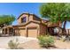 Charming two-story home featuring a tile roof and a spacious two-car garage at 14436 N 162Nd Ln, Surprise, AZ 85379