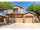 Charming two-story home featuring a tile roof and a spacious two-car garage at 14436 N 162Nd Ln, Surprise, AZ 85379