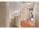 Upstairs hallway featuring sleek floors, neutral walls, and sunny window at 14436 N 162Nd Ln, Surprise, AZ 85379