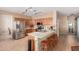 Well-equipped kitchen with stainless steel appliances and breakfast bar seating at 14436 N 162Nd Ln, Surprise, AZ 85379