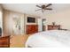 Serene main bedroom featuring wood-look floors and an attached bathroom at 14436 N 162Nd Ln, Surprise, AZ 85379