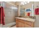 Clean bathroom featuring a granite countertop, shower, and warm neutral walls at 1535 W Winter Dr, Phoenix, AZ 85021