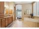 Luxurious bathroom with jetted tub, granite counters, and elegant fixtures at 1535 W Winter Dr, Phoenix, AZ 85021