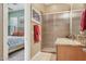 Adjacent to the bedroom is a bright bathroom with granite countertop, shower, and neutral walls at 1535 W Winter Dr, Phoenix, AZ 85021