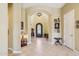 Grand foyer featuring an arched entryway, tile flooring, and decorative details at 1535 W Winter Dr, Phoenix, AZ 85021