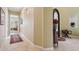 Inviting hallway with neutral walls, tiled floor, and elegant decor leading into the living area at 1535 W Winter Dr, Phoenix, AZ 85021