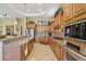 Spacious kitchen featuring granite countertops, tile backsplash, and stainless steel appliances at 1535 W Winter Dr, Phoenix, AZ 85021