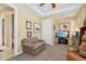 Relaxing living room with sofa, entertainment center, and view into the tiled foyer at 1535 W Winter Dr, Phoenix, AZ 85021