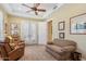 Comfortable living room with sofa, reading chairs, French doors, and great natural lighting at 1535 W Winter Dr, Phoenix, AZ 85021