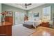 Spacious main bedroom with tray ceiling, shuttered windows, and sitting area at 1535 W Winter Dr, Phoenix, AZ 85021