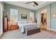 Comfortable bedroom with ceiling fan, ensuite, and beautiful natural light at 1535 W Winter Dr, Phoenix, AZ 85021