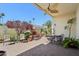 Charming outdoor patio with brick flooring, fireplace and lush landscaping offers a relaxing space at 1535 W Winter Dr, Phoenix, AZ 85021