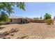 Wide backyard view of a house with a patio and desert landscaping at 2056 E San Tan Ct, Gilbert, AZ 85296