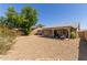 View of backyard featuring desert landscaping, covered patio, and house at 2056 E San Tan Ct, Gilbert, AZ 85296