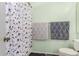 Bathroom featuring a shower with whimsical shower curtain and coordinated towels at 2056 E San Tan Ct, Gilbert, AZ 85296