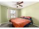 Cozy bedroom featuring a ceiling fan, neutral walls, and a comfortable bed at 2056 E San Tan Ct, Gilbert, AZ 85296