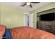 Bedroom featuring a ceiling fan, closet, and dresser with a TV at 2056 E San Tan Ct, Gilbert, AZ 85296