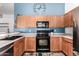 Well-maintained kitchen featuring wood cabinetry, stainless appliances, and an open layout design at 2056 E San Tan Ct, Gilbert, AZ 85296