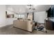 Open living room boasts vaulted ceilings, neutral tones, carpet flooring and sliding glass doors to the outdoor area at 2056 E San Tan Ct, Gilbert, AZ 85296