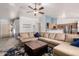 Open-concept living space with carpet flooring, modern decor, and lots of natural light at 2056 E San Tan Ct, Gilbert, AZ 85296