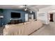 Spacious living room features carpet flooring, vaulted ceilings, accent wall, and a large sectional sofa at 2056 E San Tan Ct, Gilbert, AZ 85296