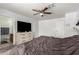 Bright main bedroom offering carpet flooring, ensuite bathroom and a ceiling fan at 2056 E San Tan Ct, Gilbert, AZ 85296