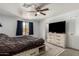 Nicely decorated main bedroom features carpet flooring, ensuite bathroom and plenty of natural light at 2056 E San Tan Ct, Gilbert, AZ 85296