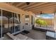 Outdoor patio with comfortable seating, ceiling fan, and sliding glass door access at 2056 E San Tan Ct, Gilbert, AZ 85296
