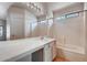 Bathroom features a tub-shower combo and bright vanity at 2822 N 90Th Ave, Phoenix, AZ 85037