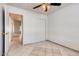 Bedroom featuring bright tile floors, a closet, and neutral paint at 2822 N 90Th Ave, Phoenix, AZ 85037