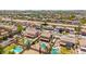 Expansive aerial view of a residential neighborhood, showcasing homes with pools and desert landscaping at 31453 N Blackfoot Dr, San Tan Valley, AZ 85143