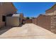 Backyard with ample open space features a storage shed and privacy fence at 31453 N Blackfoot Dr, San Tan Valley, AZ 85143